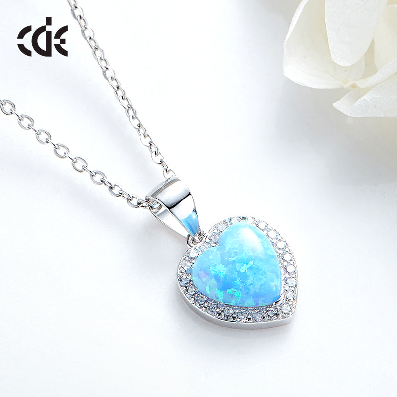 Elegant silver opal necklace for women featuring a heart-shaped pendant surrounded by sparkling stones