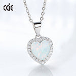 Elegant silver opal necklace for women with a heart-shaped pendant surrounded by sparkling stones