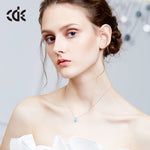 Elegant silver opal necklace for women showcased on a model with a minimalist design