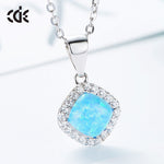 Elegant sterling silver opal necklace featuring a square opal pendant surrounded by sparkling stones
