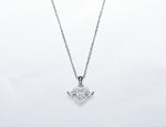 Sterling silver angel wing necklace featuring a heart pendant adorned with sparkling details