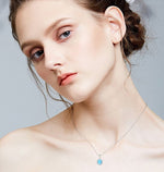 Elegant sterling silver opal necklace displayed on a model for a stylish look