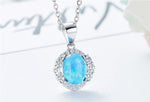 Sterling silver opal necklace featuring a vibrant blue opal surrounded by sparkling stones