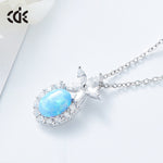 Cute flower opal pendant necklace with a shimmering blue opal and sparkling accents