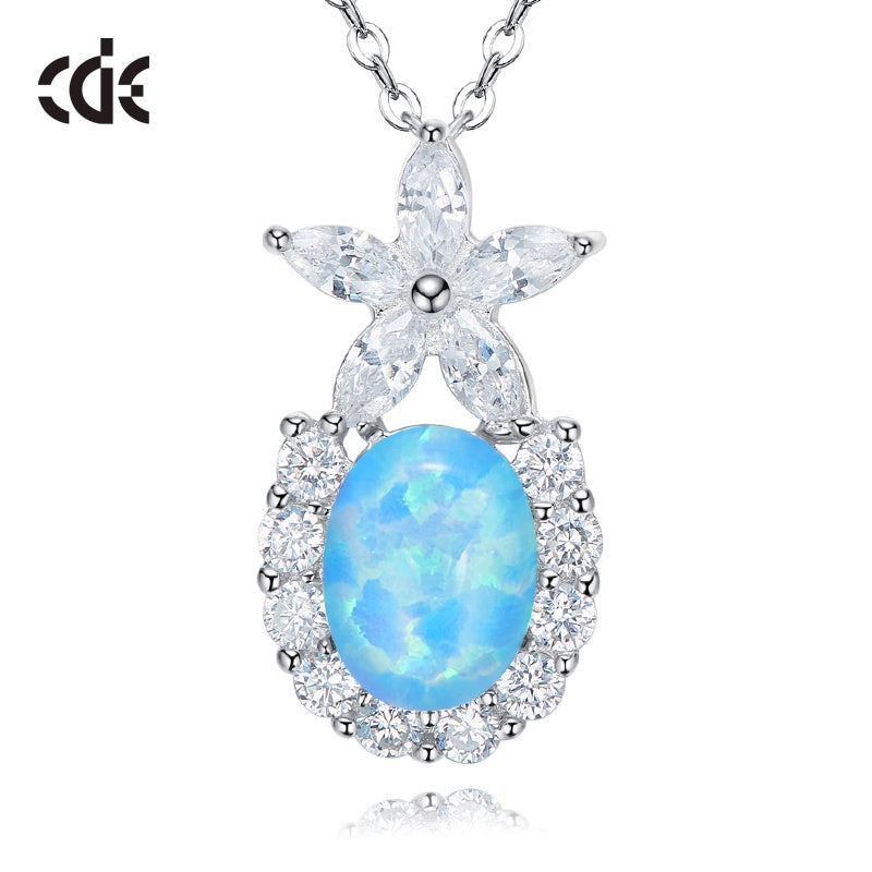 Cute flower opal pendant necklace featuring a blue opal and sparkling clear gemstones