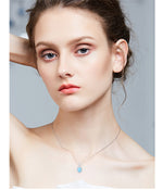 Model wearing a cute flower opal pendant necklace that adds elegance to any outfit