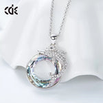 The fancy dolphin in a Sapphire / Amethyst circle necklace -Glintzia Jewelry