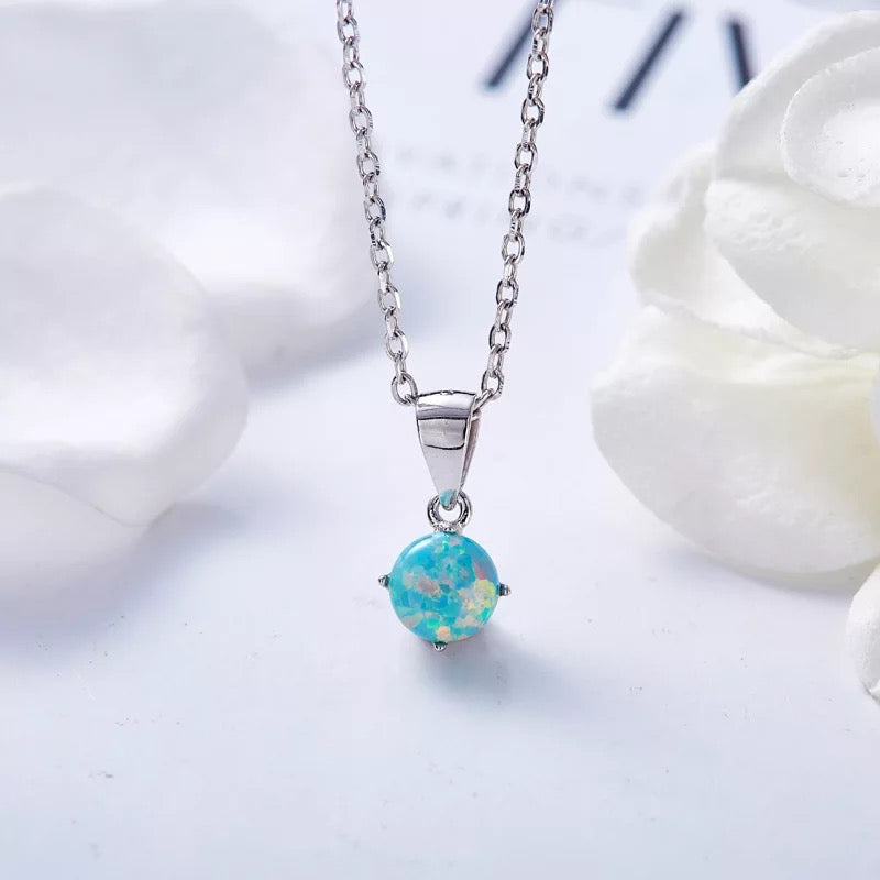 Sterling silver lab-created opal necklace with a blue pendant on a delicate chain — Glintzia