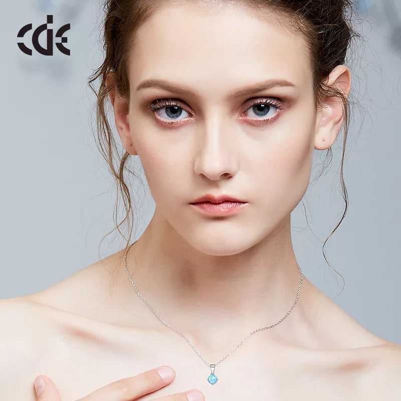Sterling silver lab-created opal necklace with a delicate pendant on a silver chain — Glintzia