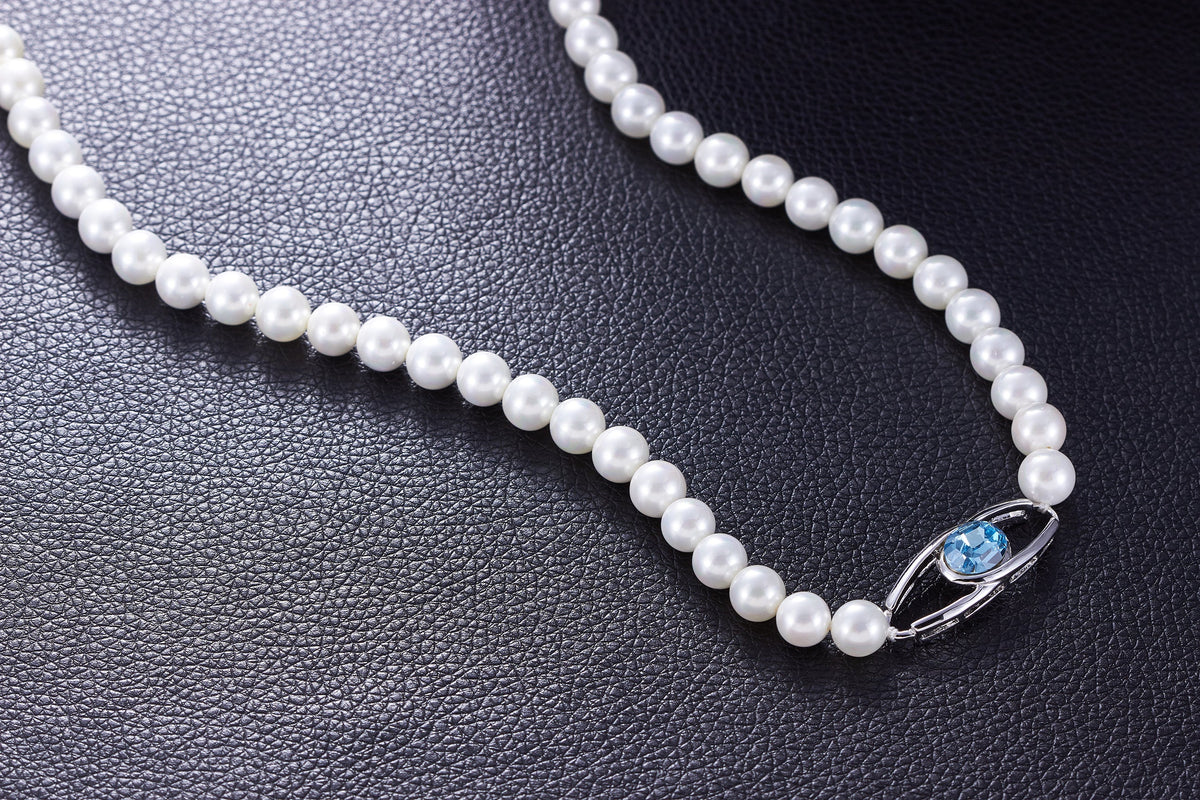 The classy pearl collier with a blue topaz swarovski pendant -Glintzia Jewelry