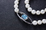 The classy pearl collier with a blue topaz swarovski pendant -Glintzia Jewelry